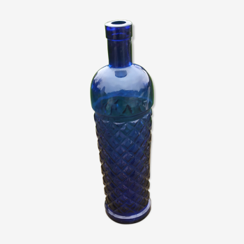 Vintage bottle in chiseled blue glass