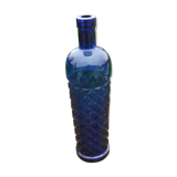Vintage bottle in chiseled blue glass