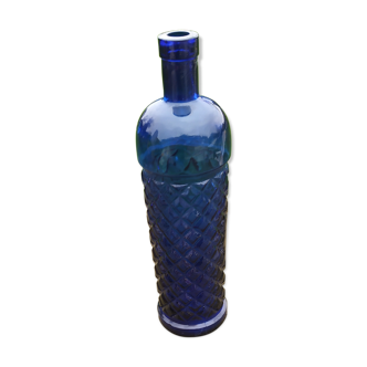 Vintage bottle in chiseled blue glass