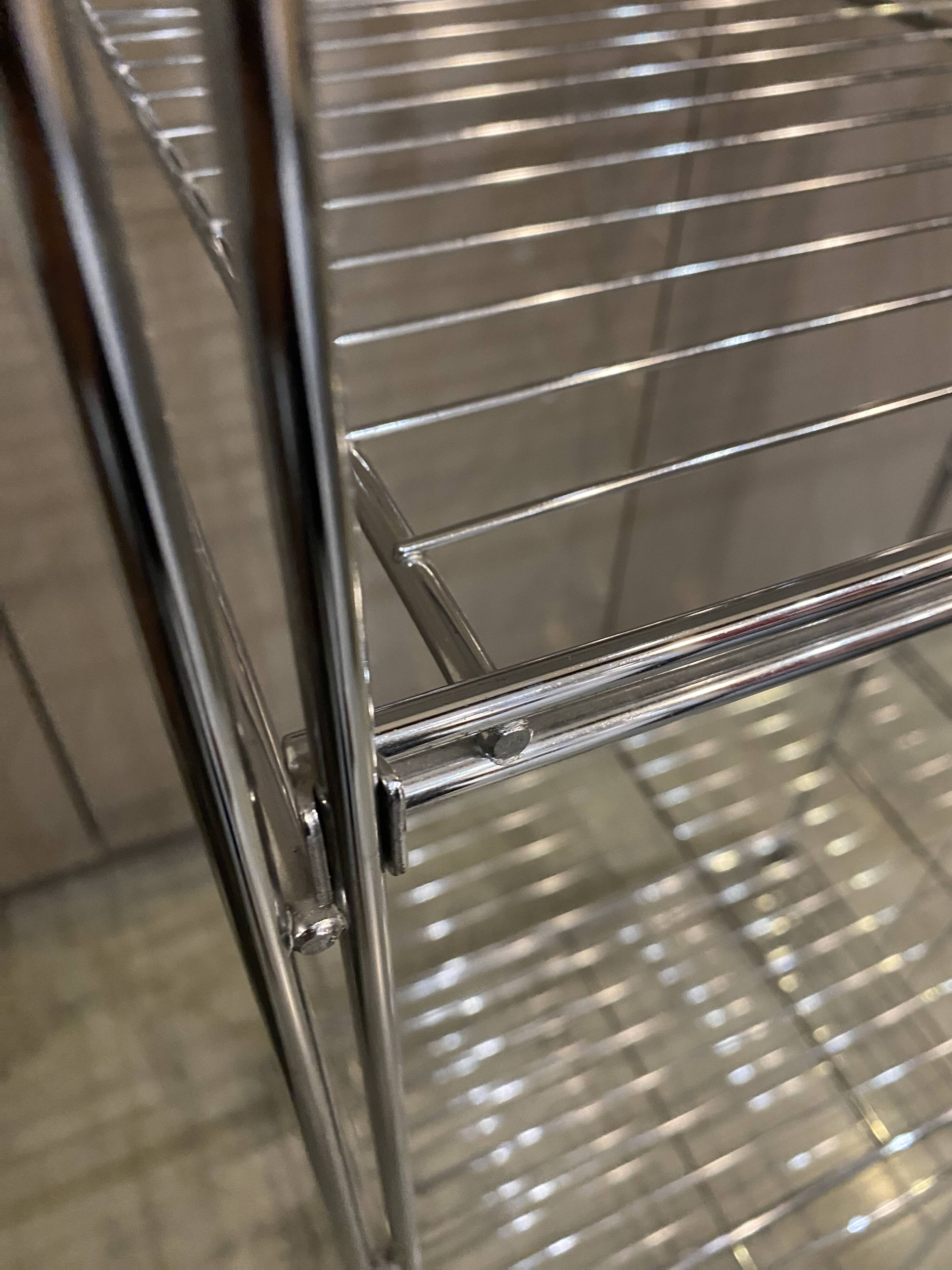 Modular wall bookshelf desk in vintage chrome.