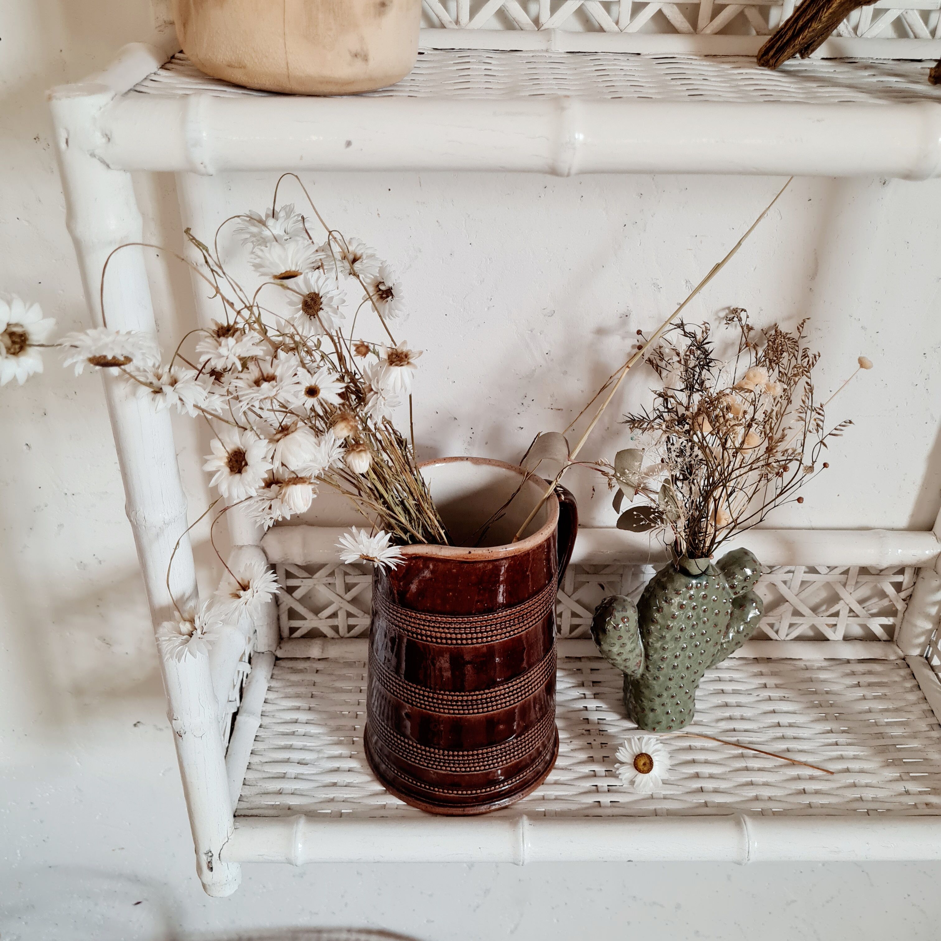 Vintage rattan and bamboo shelves painted white
