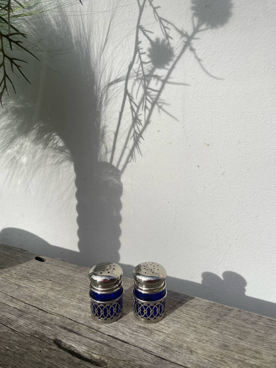 Silver-plated metal and blue glass salt and pepper shaker