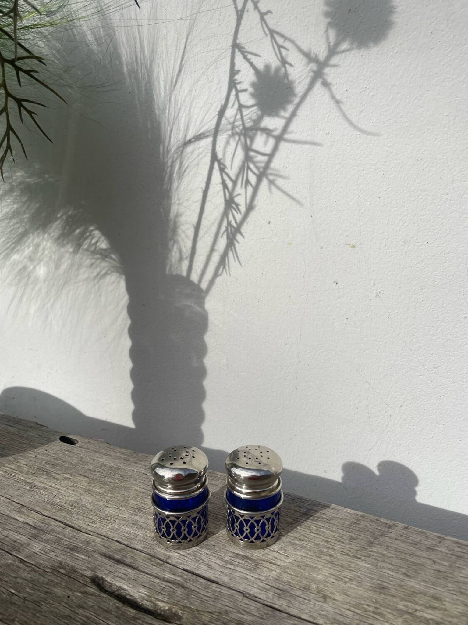 Silver-plated metal and blue glass salt and pepper shaker