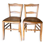 Pair of vintage chairs from the late 20th century with caning.