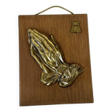 Suspension of praying hands