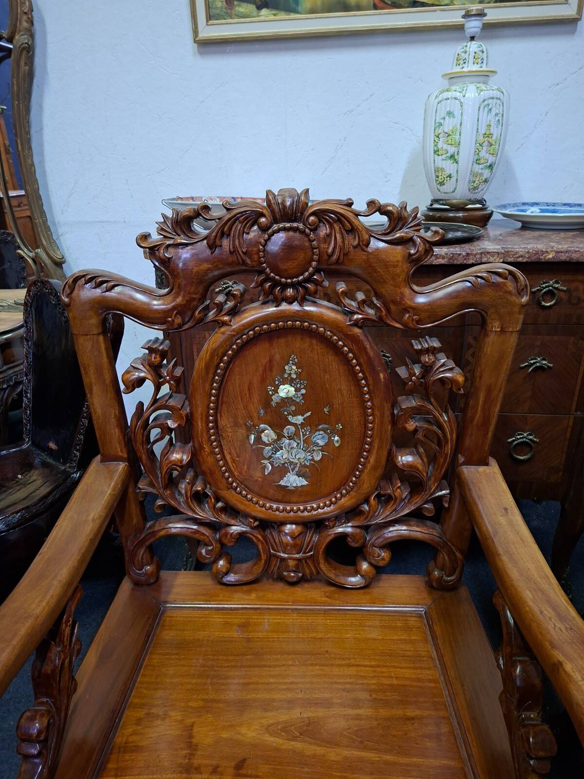 Pair of Asian armchairs in carved wood with mother-of-pearl inlays.