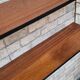 Shelf 1950 has 70 gold uprights and and plating shelf with black plastic border,