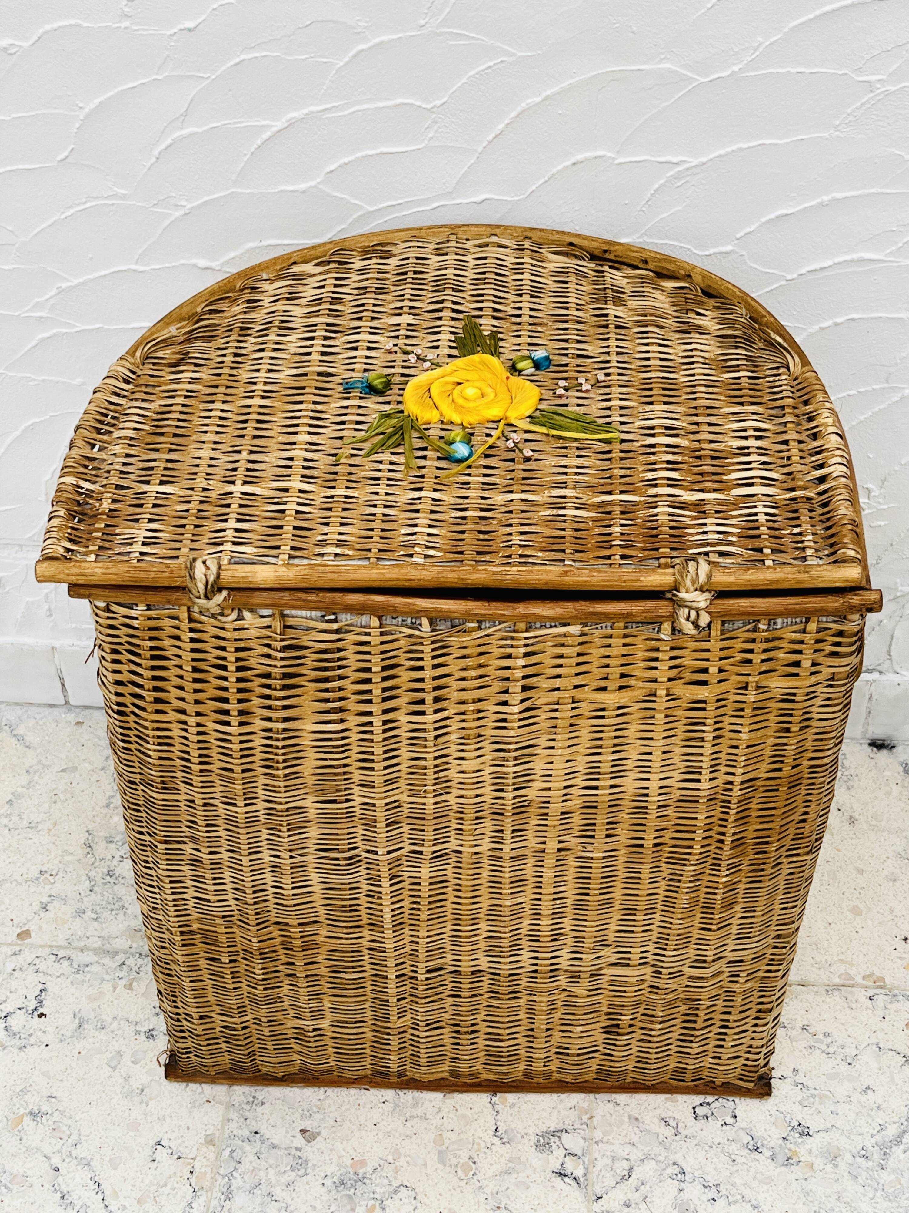 Vintage wicker mannequin with colourful floral decoration.