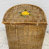 Vintage wicker mannequin with colourful floral decoration.