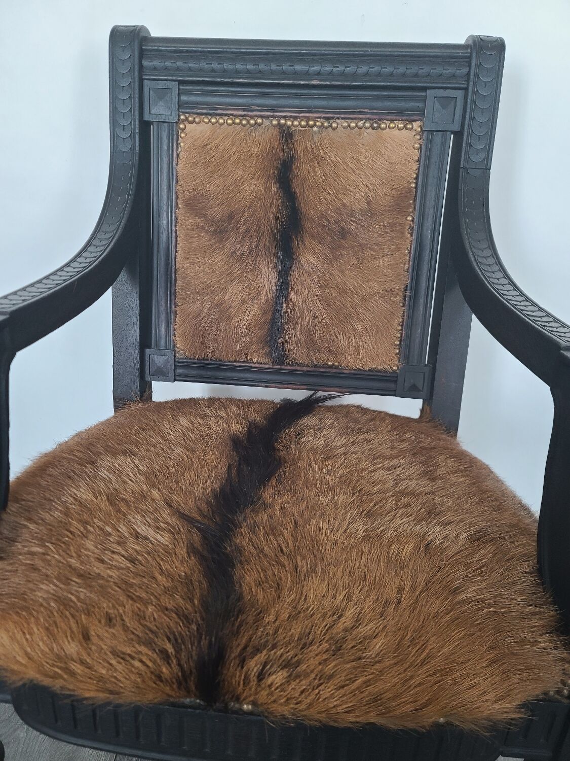 Character armchair in black wood and animal skin #CHMR