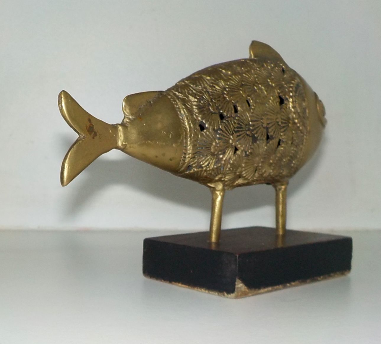 Bronze fish on pedestal India