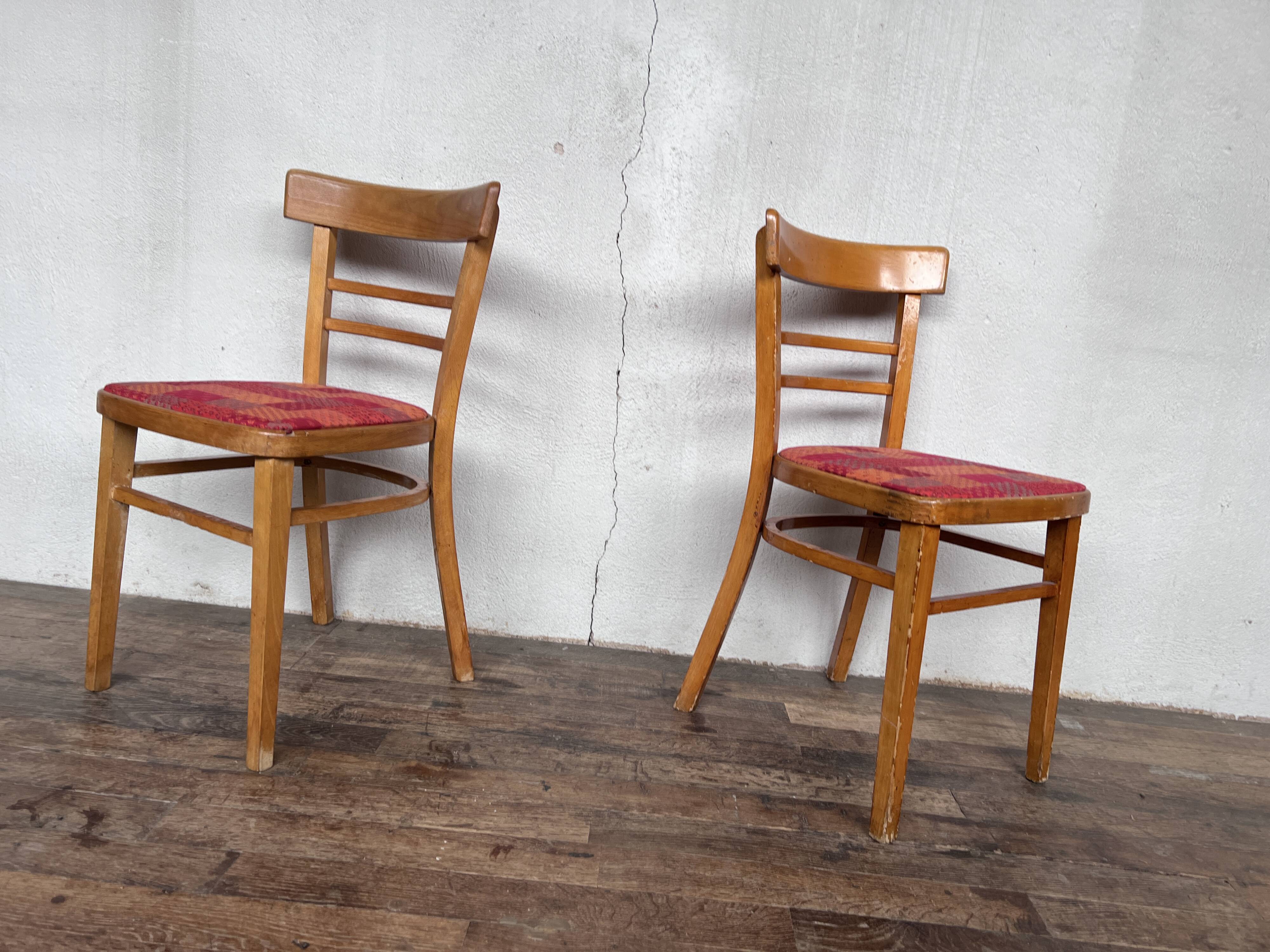 Pair of chairs in light wood and vintage red fabric 1960