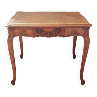 Antique wooden desk with flowers