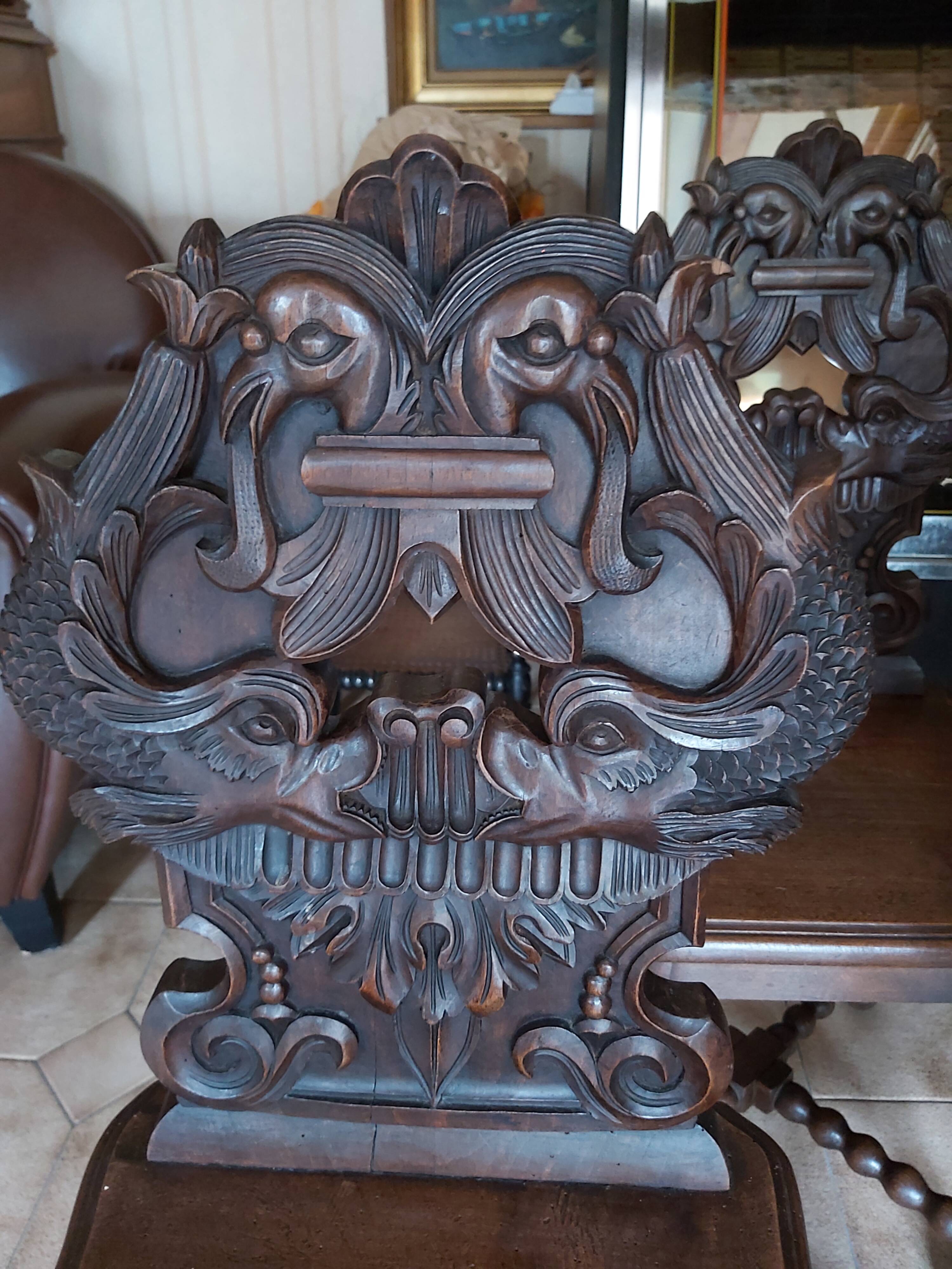 4 stylized dolphin back chairs