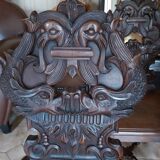 4 stylized dolphin back chairs