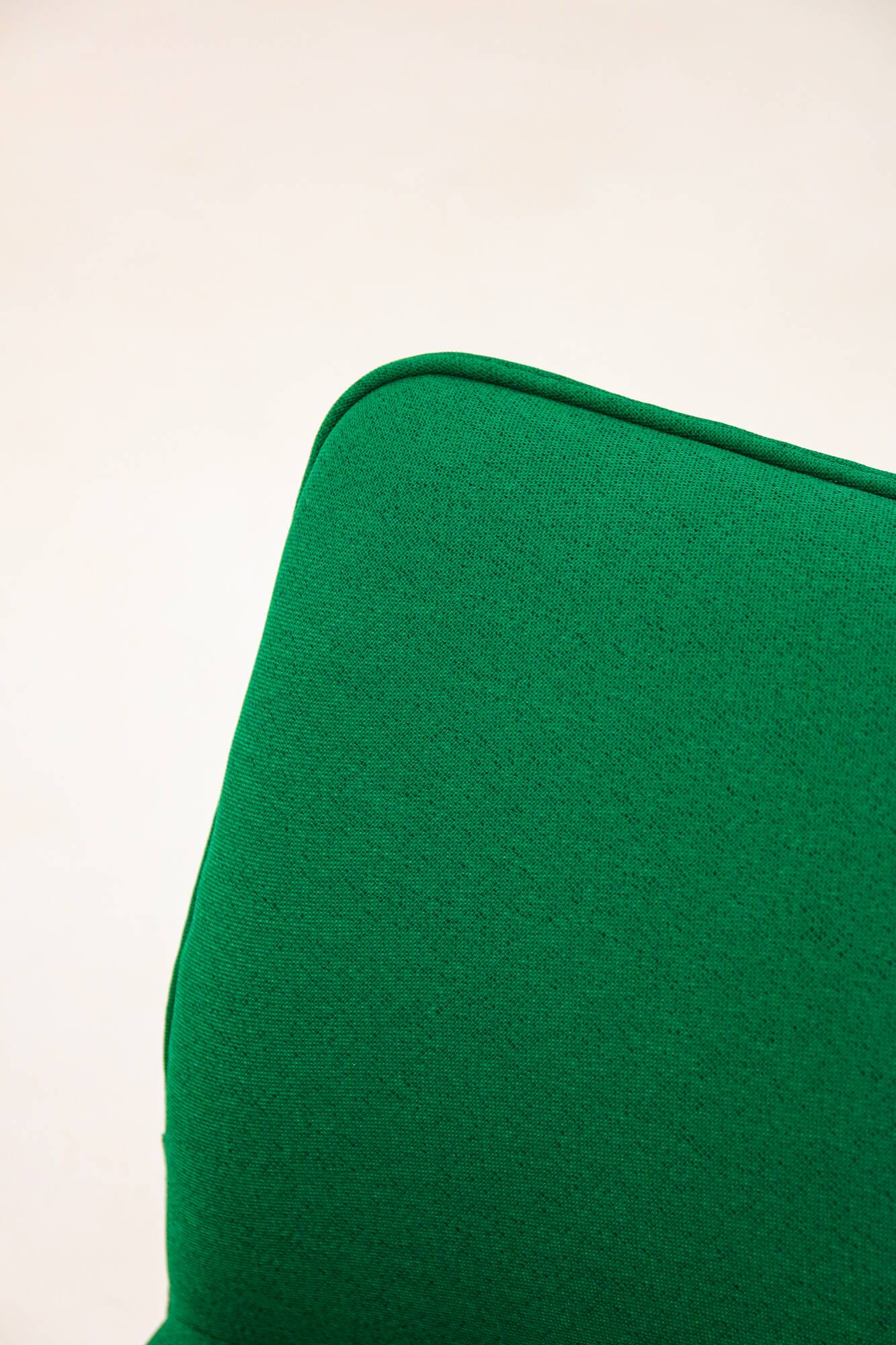 Green Artifort armchair, design by Geoffrey Harcourt.