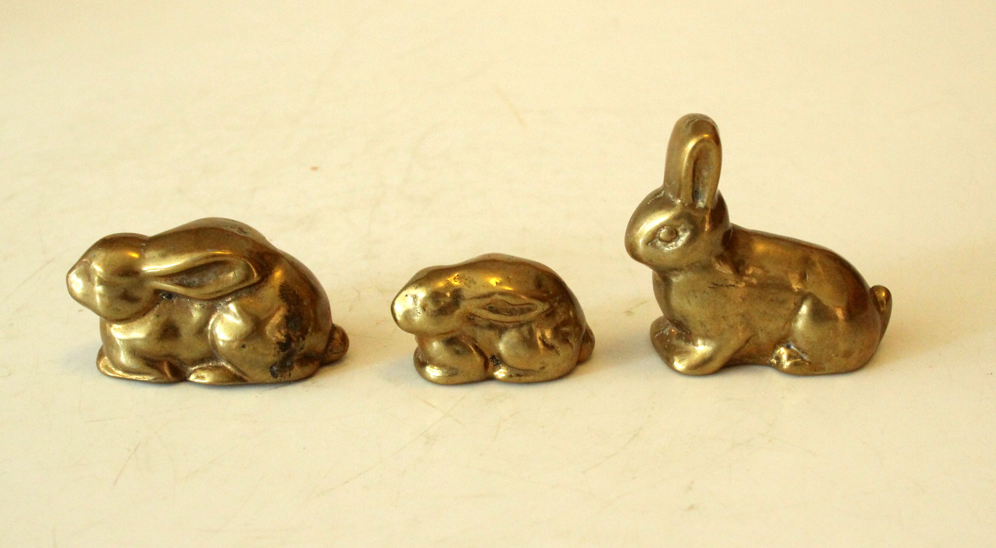 3 solid brass paperweights in the shape of rabbits vintage from the 1960s