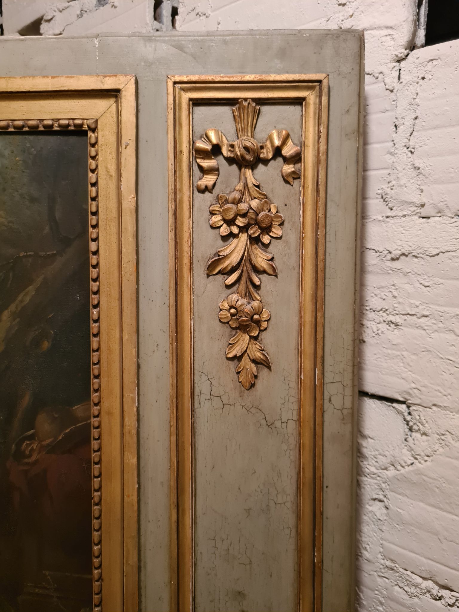 Lacquered wooden trumeau in the Louis XVI style, late 19th century.