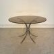 Table ronde vintage années 70 – verre fumé & piètement chrome –