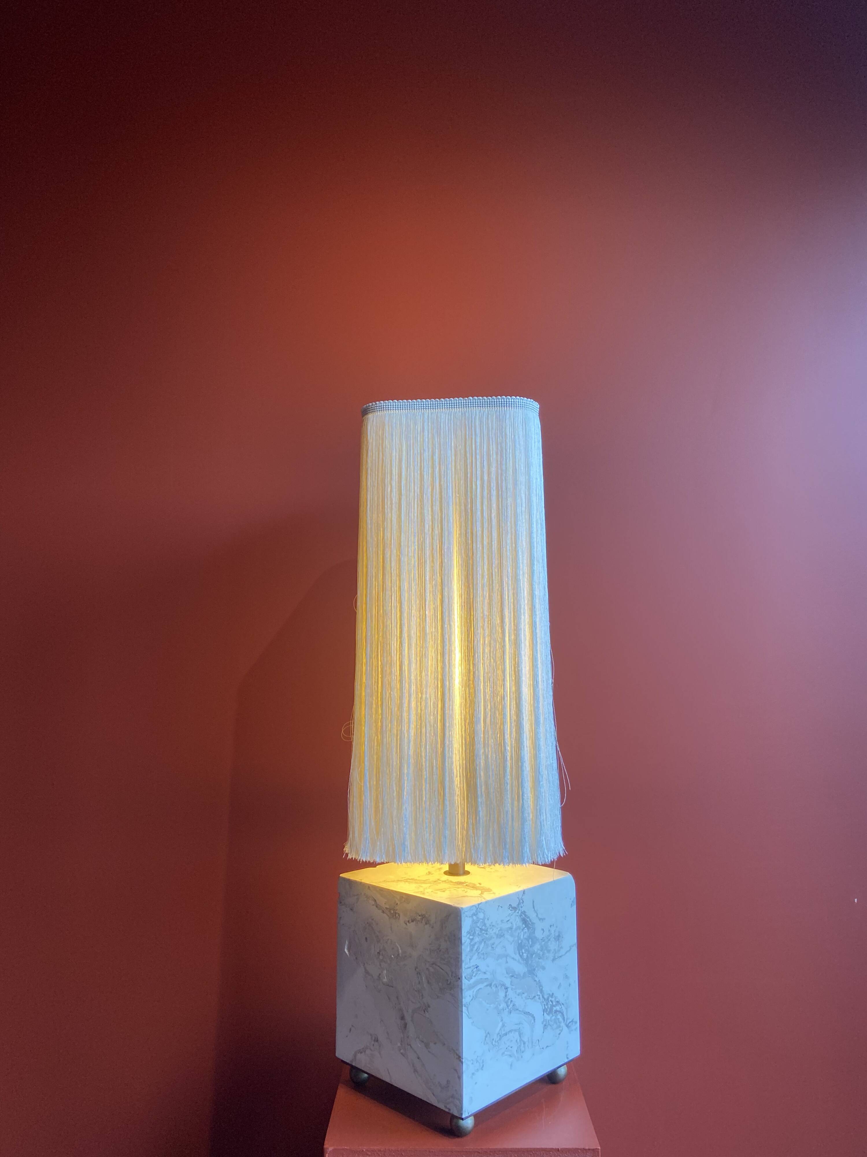 Beige marble stucco base, Houles white ecru fringed lampshade.