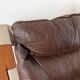 Leather and wood armchair, brutalist style.