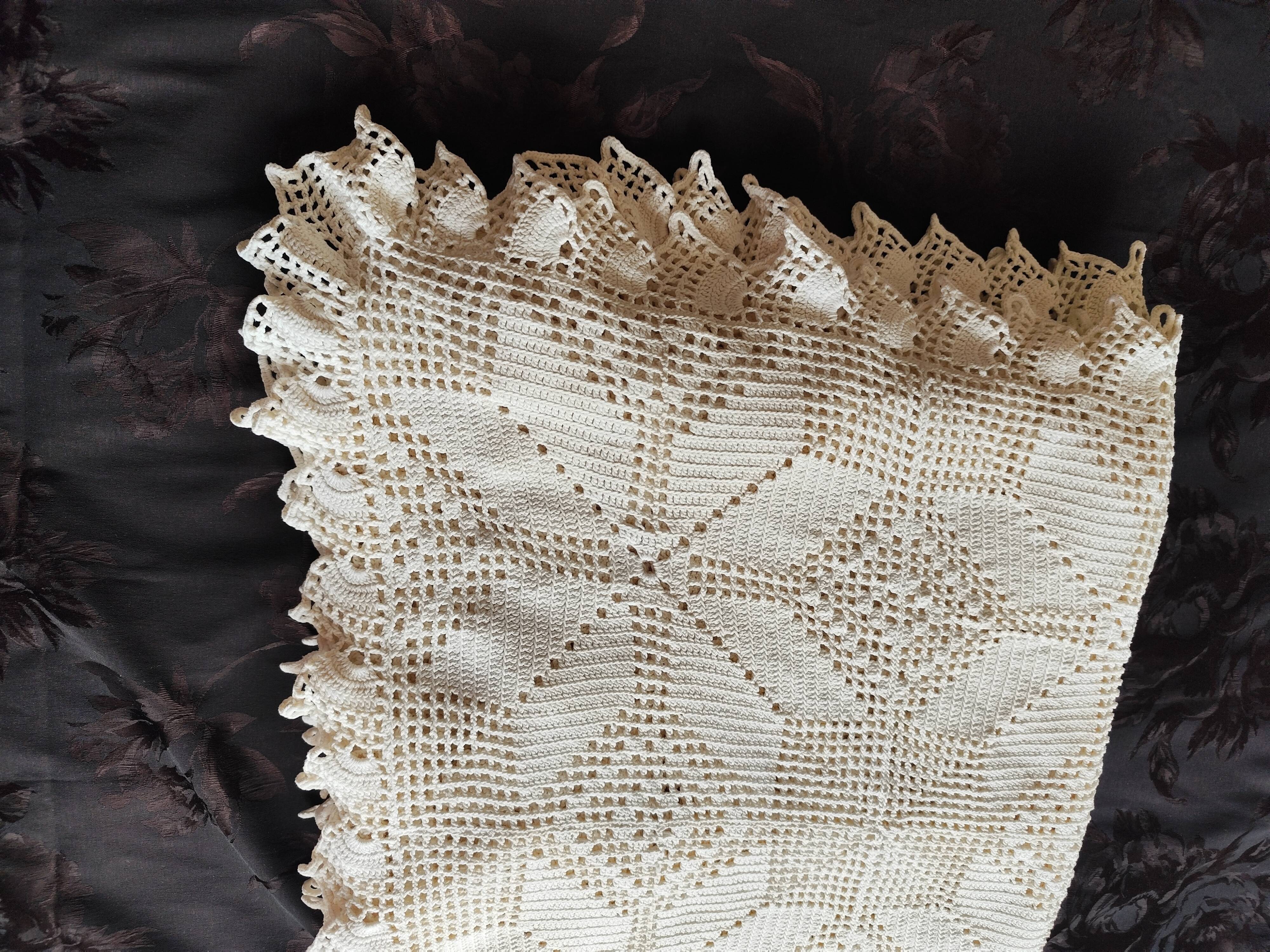 White cotton bedspread, crocheted sofa throw with star patterns