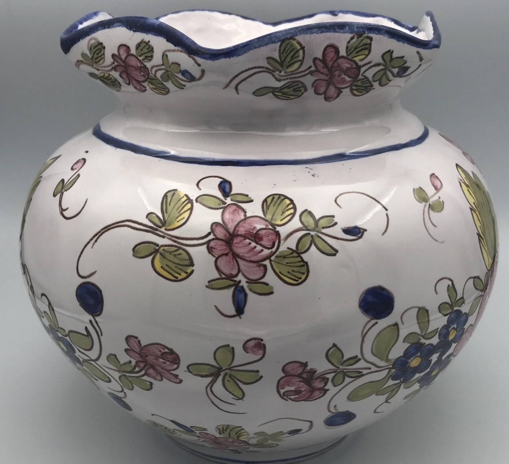 Round earthenware vase with polychrome floral motifs, signed