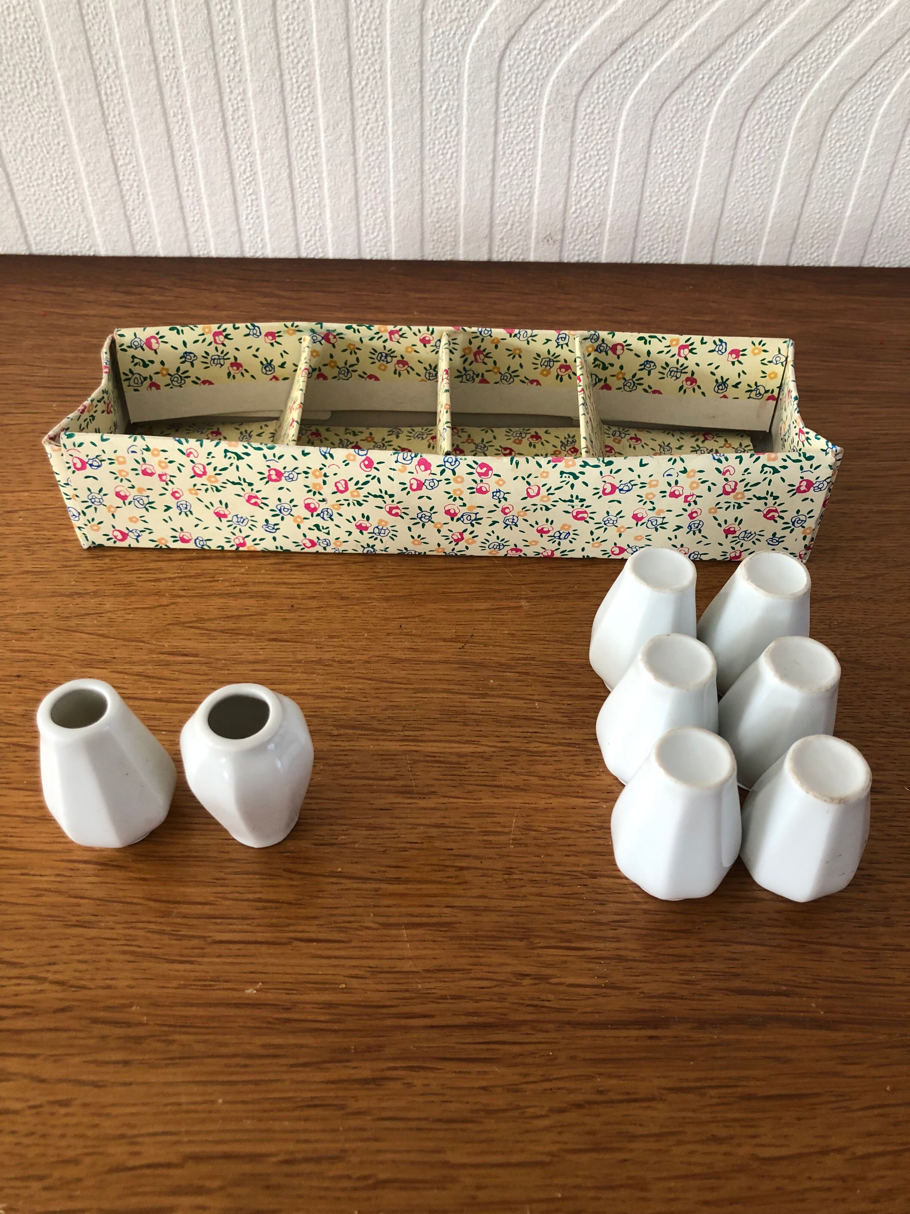 8 miniature vases in white earthenware