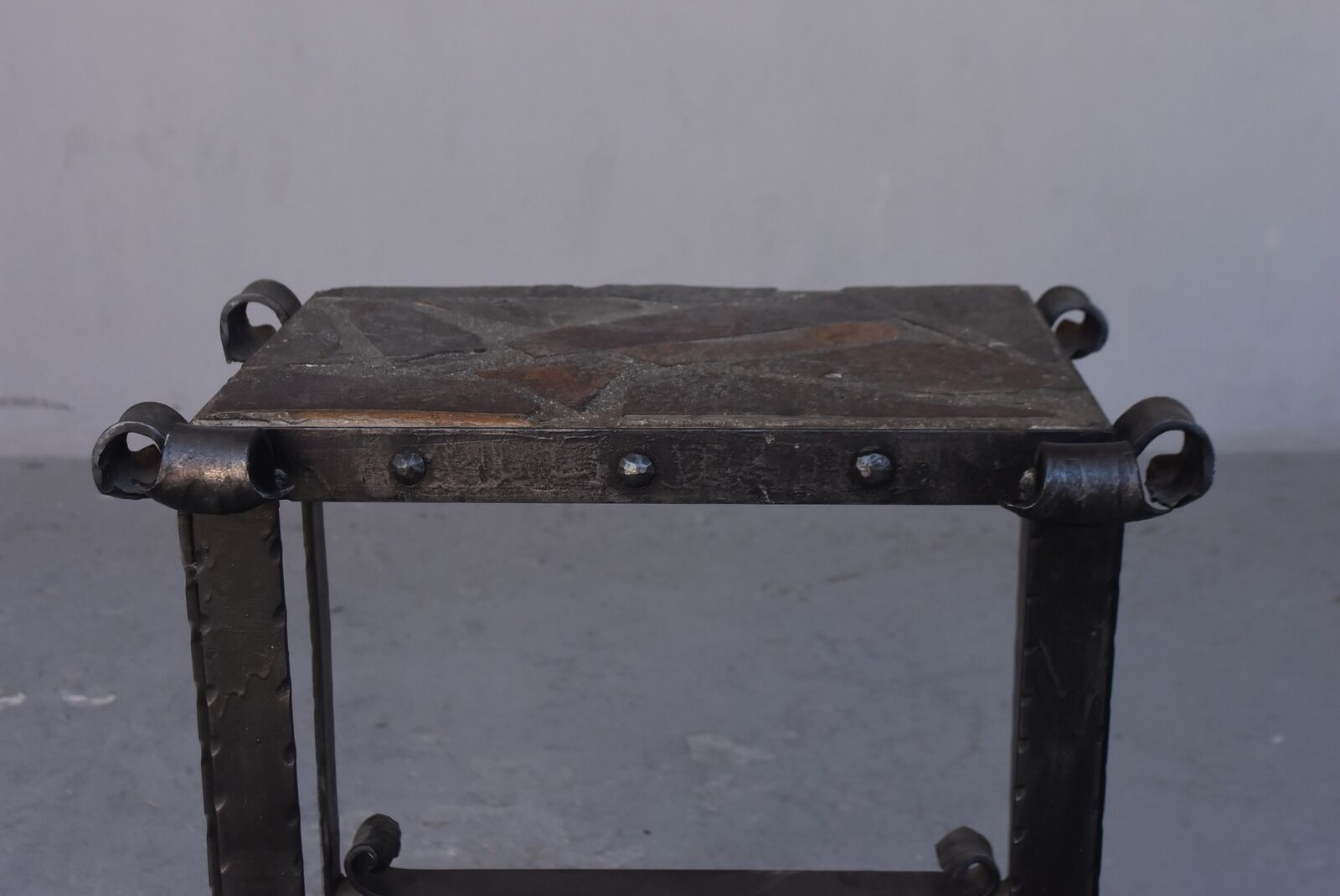 Pair of wrought iron and lava stone bedsides