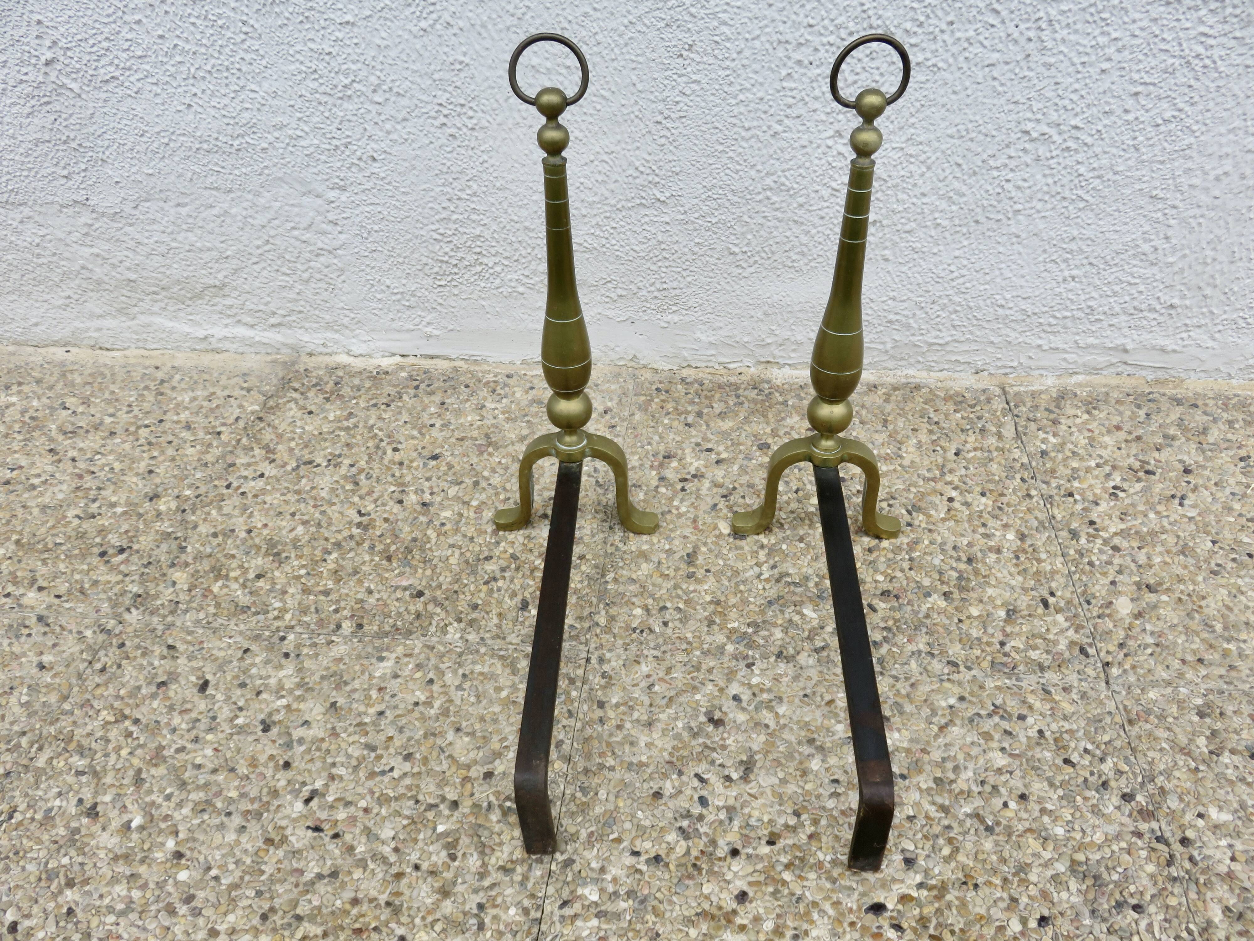 Pair of Neo-classical andirons, in solid bronze, 1920s-1930s.