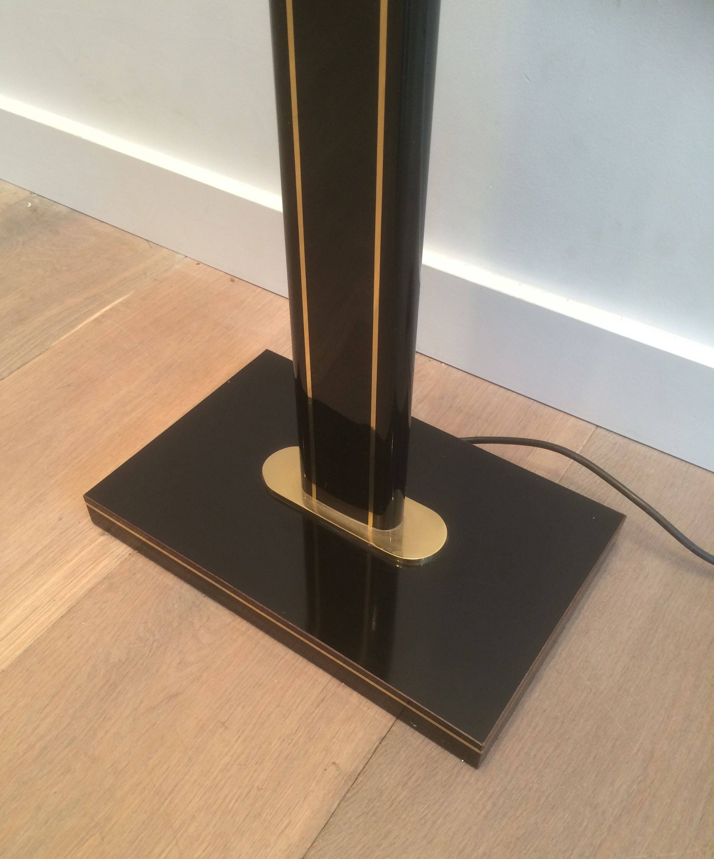Black lacquered and brass floor lamp
