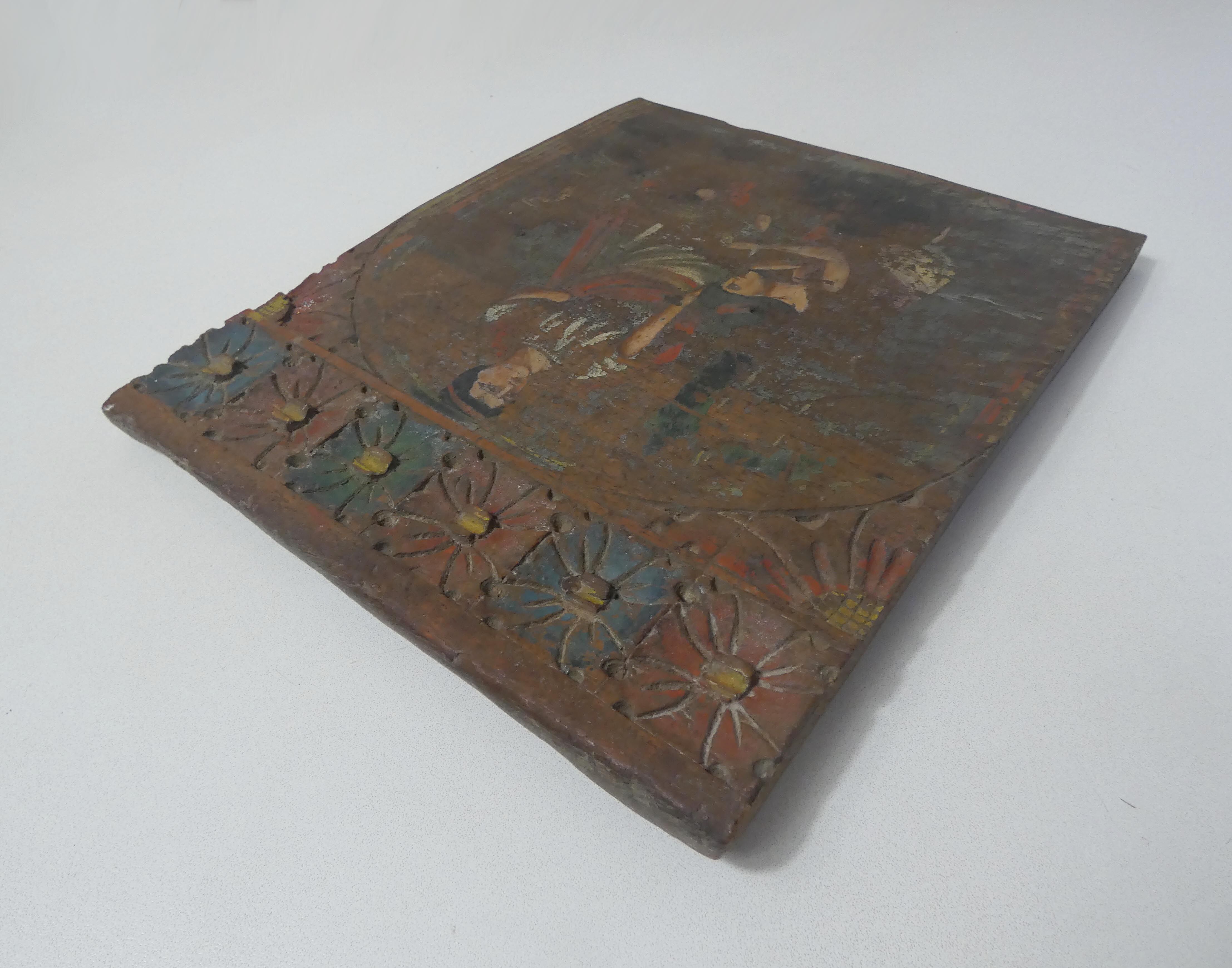 Painting on carved wood panel