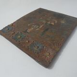 Painting on carved wood panel