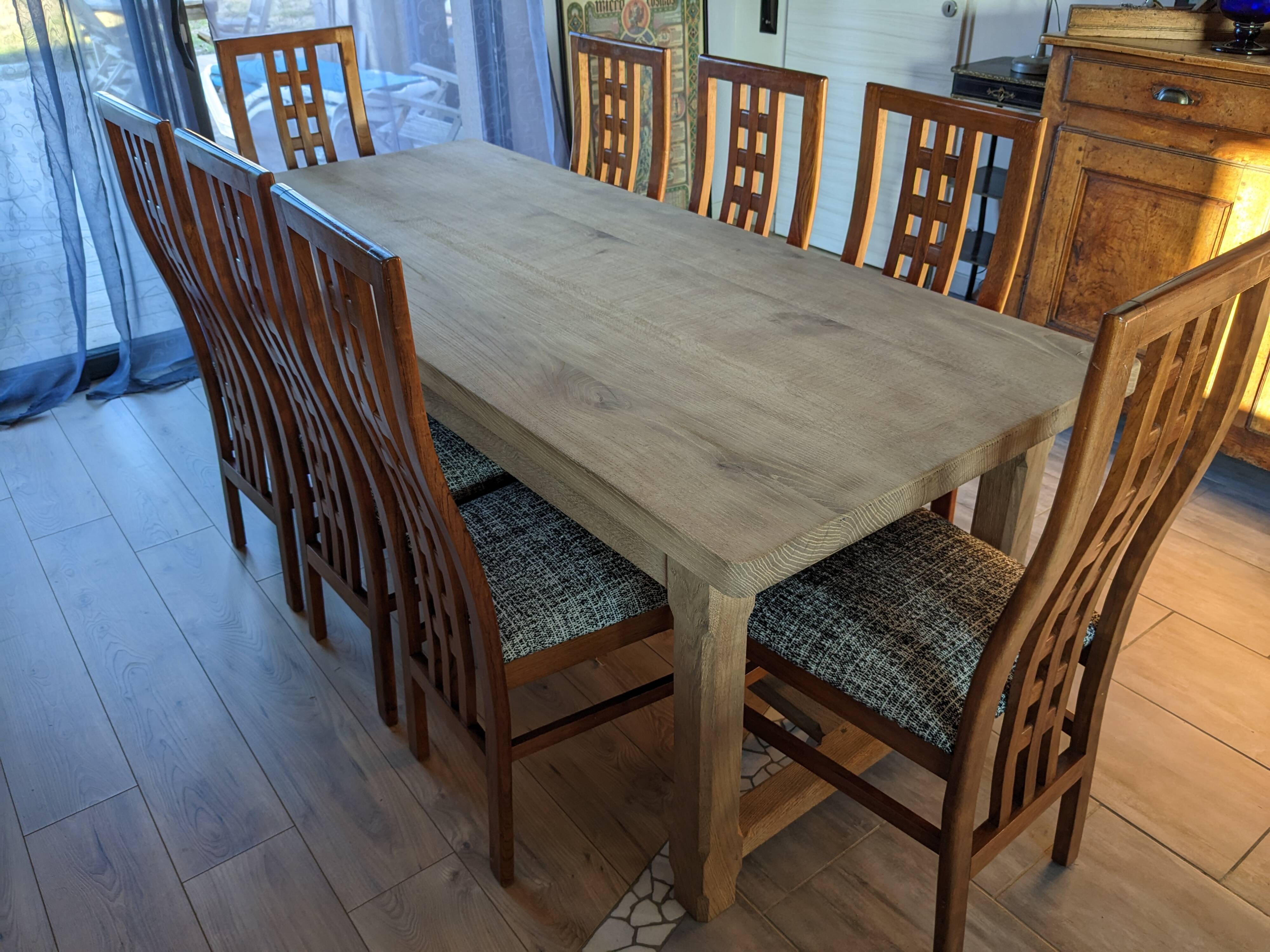 Set of 8 teak lounge chairs with high backs and zebra-striped seats