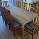 Set of 8 teak lounge chairs with high backs and zebra-striped seats