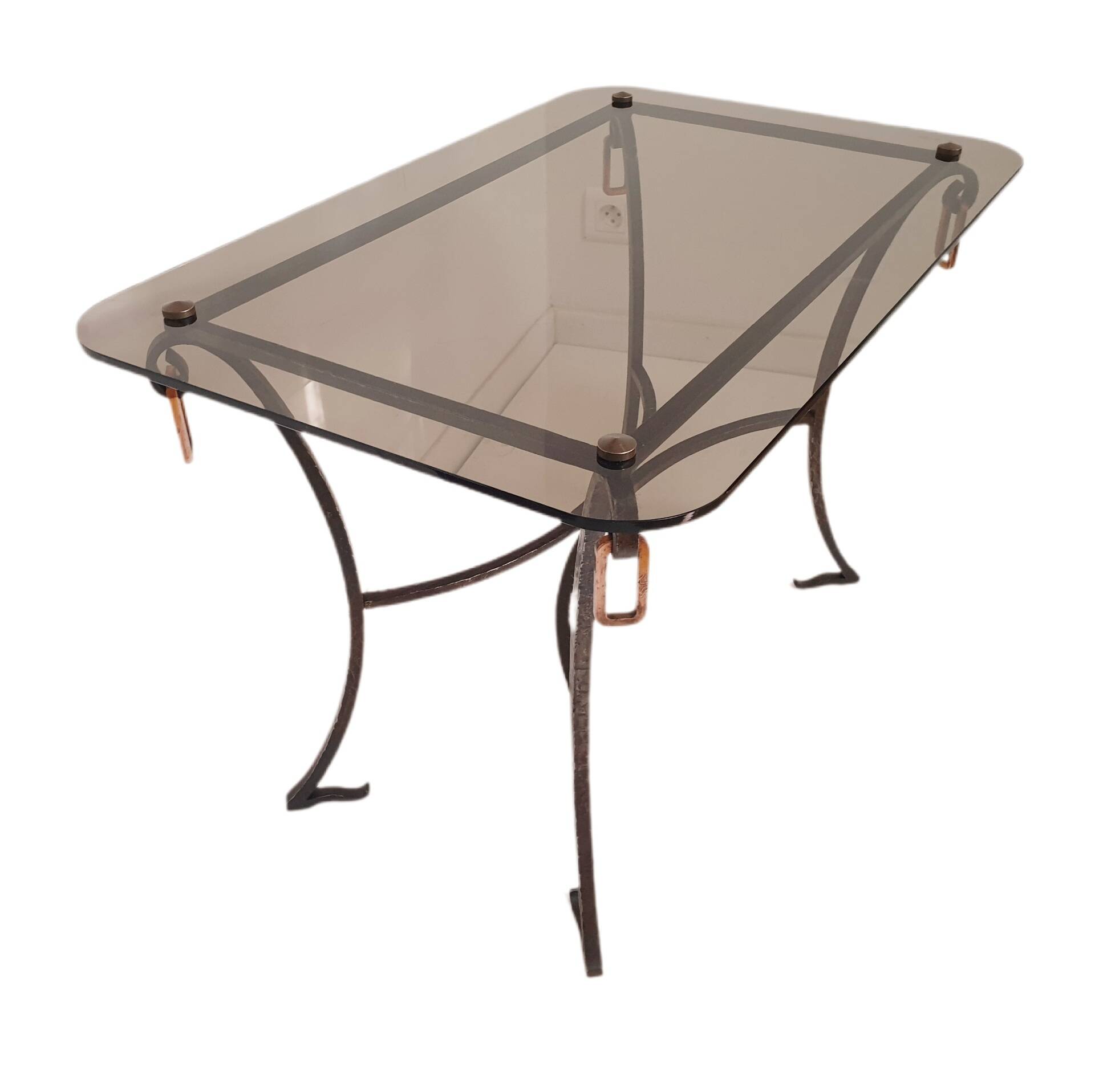 1960s/70s coffee table in wrought iron and smoked glass.