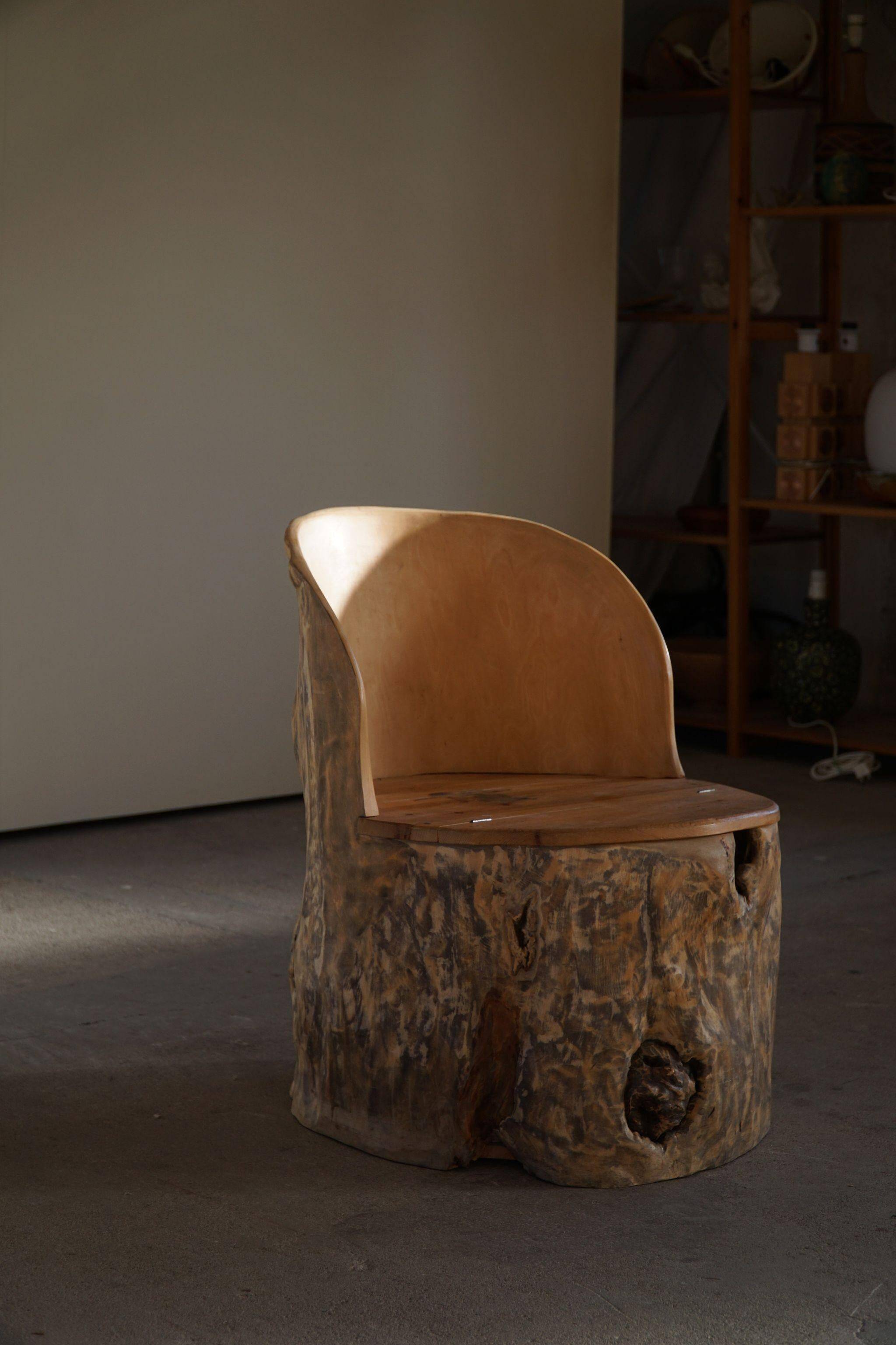 Sculptural Norwegian trunk chair in mid-century brutalist solid wood.