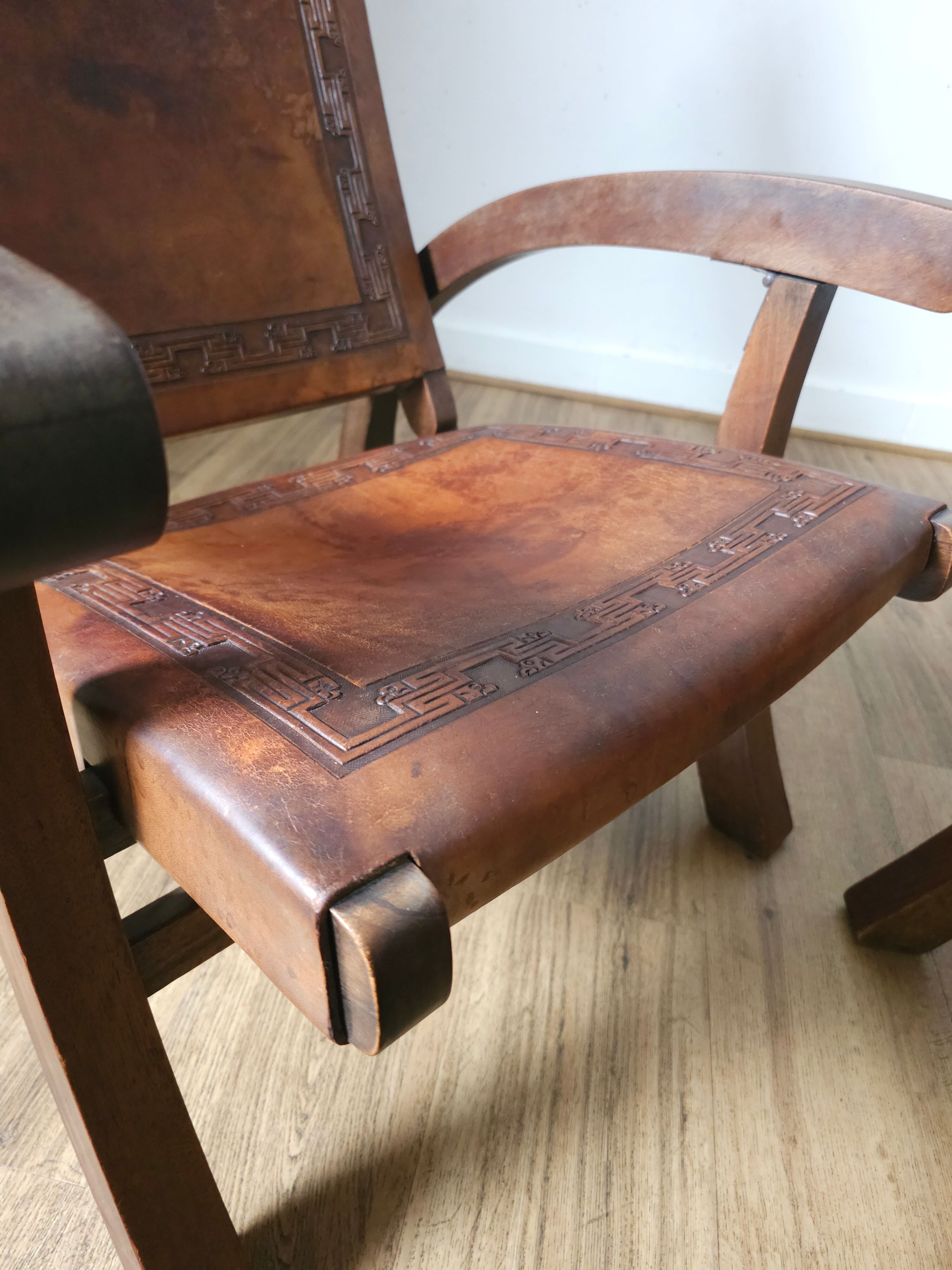 Leather and teak armchairs, by Angel Pazmino, circa 1960.
