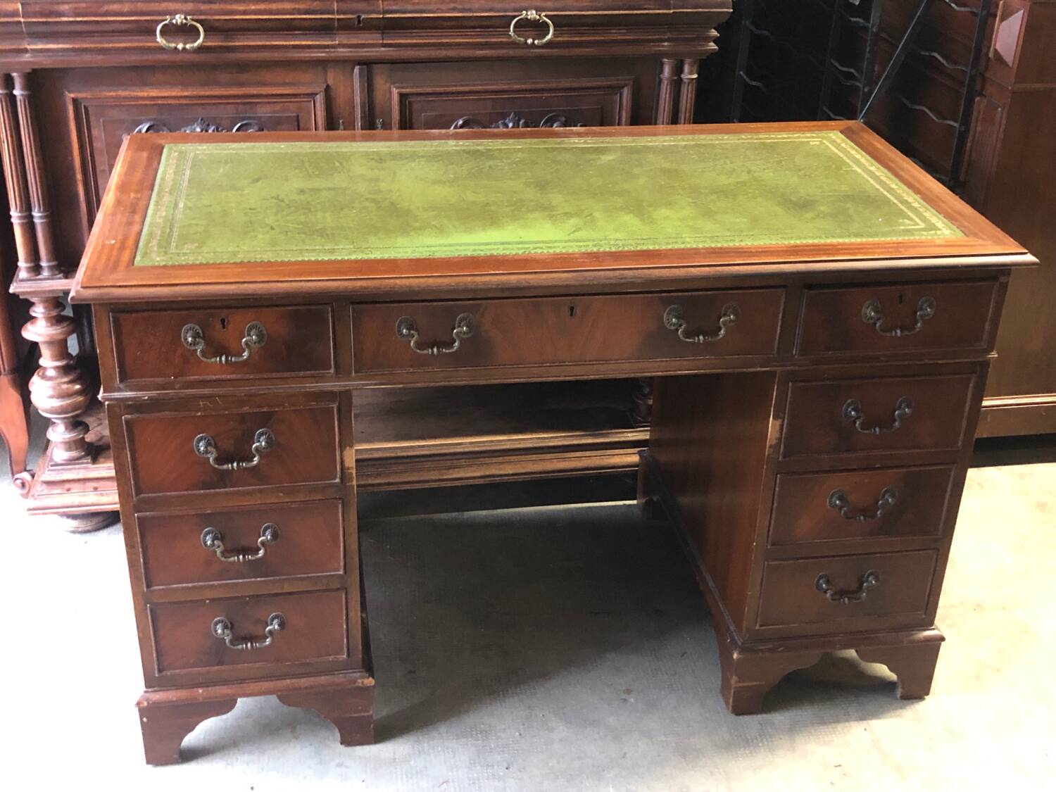 English pedestal desk with green leather top