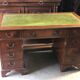 English pedestal desk with green leather top