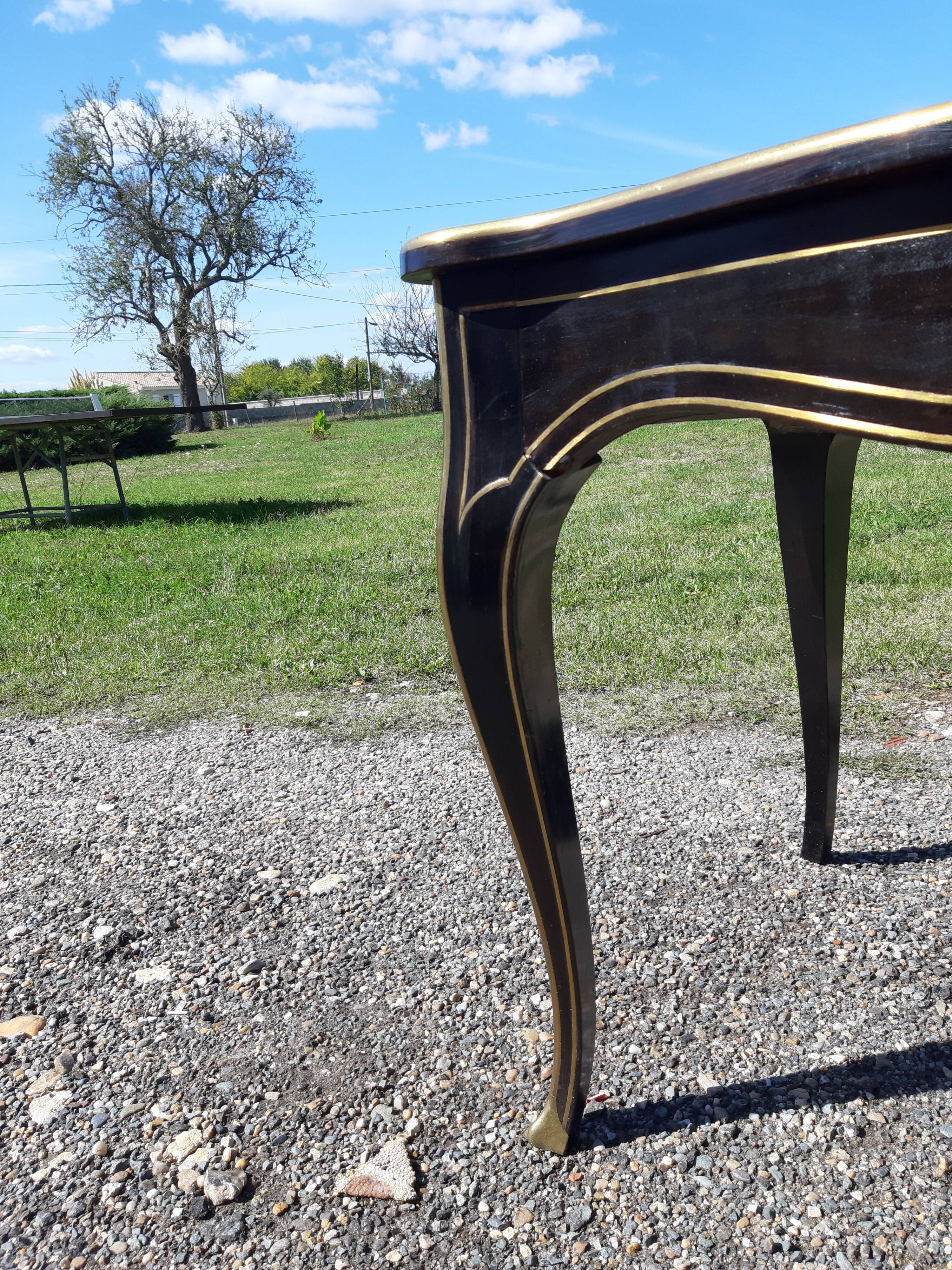 Napoleon III black lacquered wood and brass table
