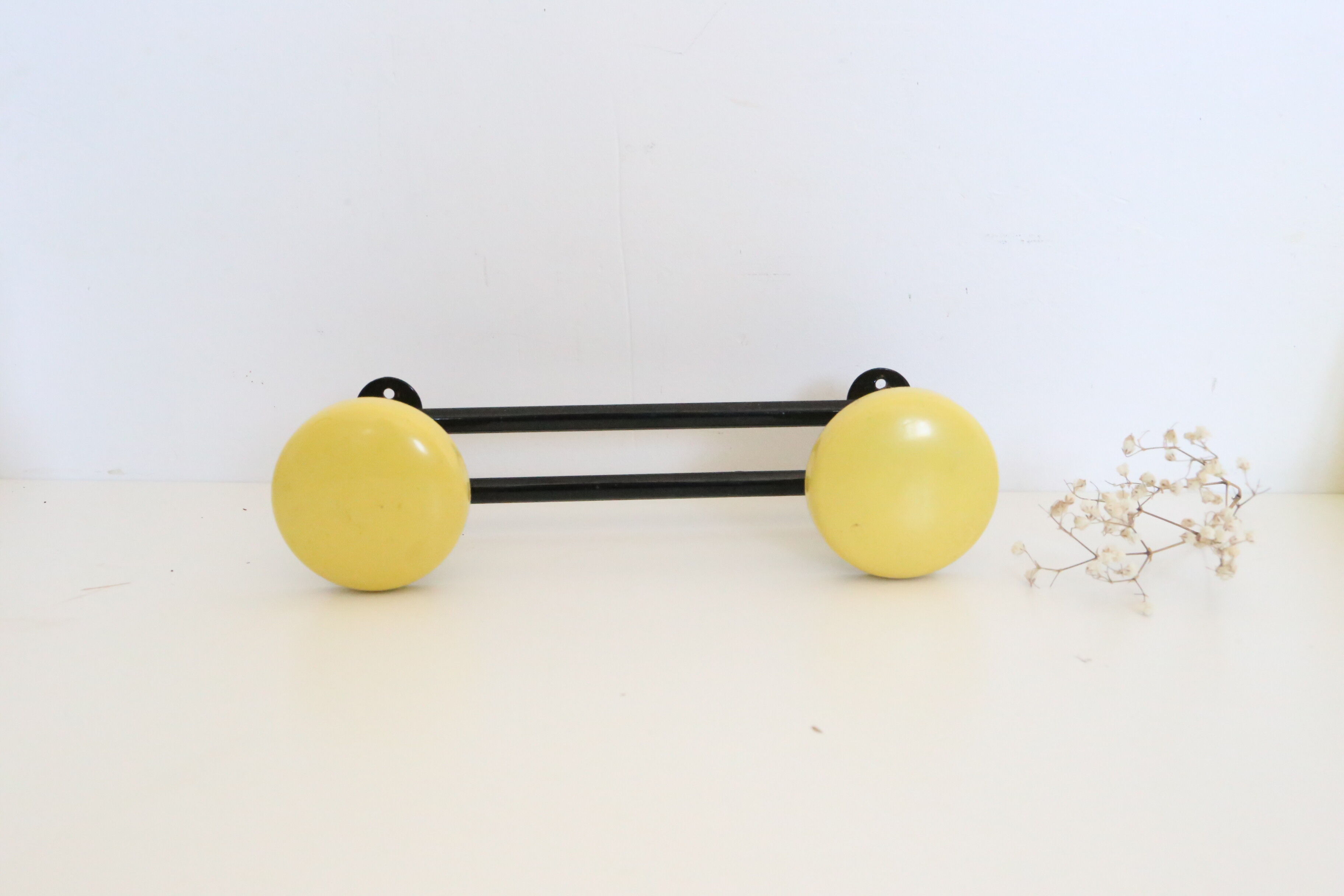 Wall coat rack in yellow and black metal, vintage