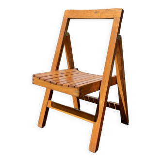 Old varnished wooden folding chair for children