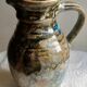 Enamelled ceramic pitcher, signature mb the terminal