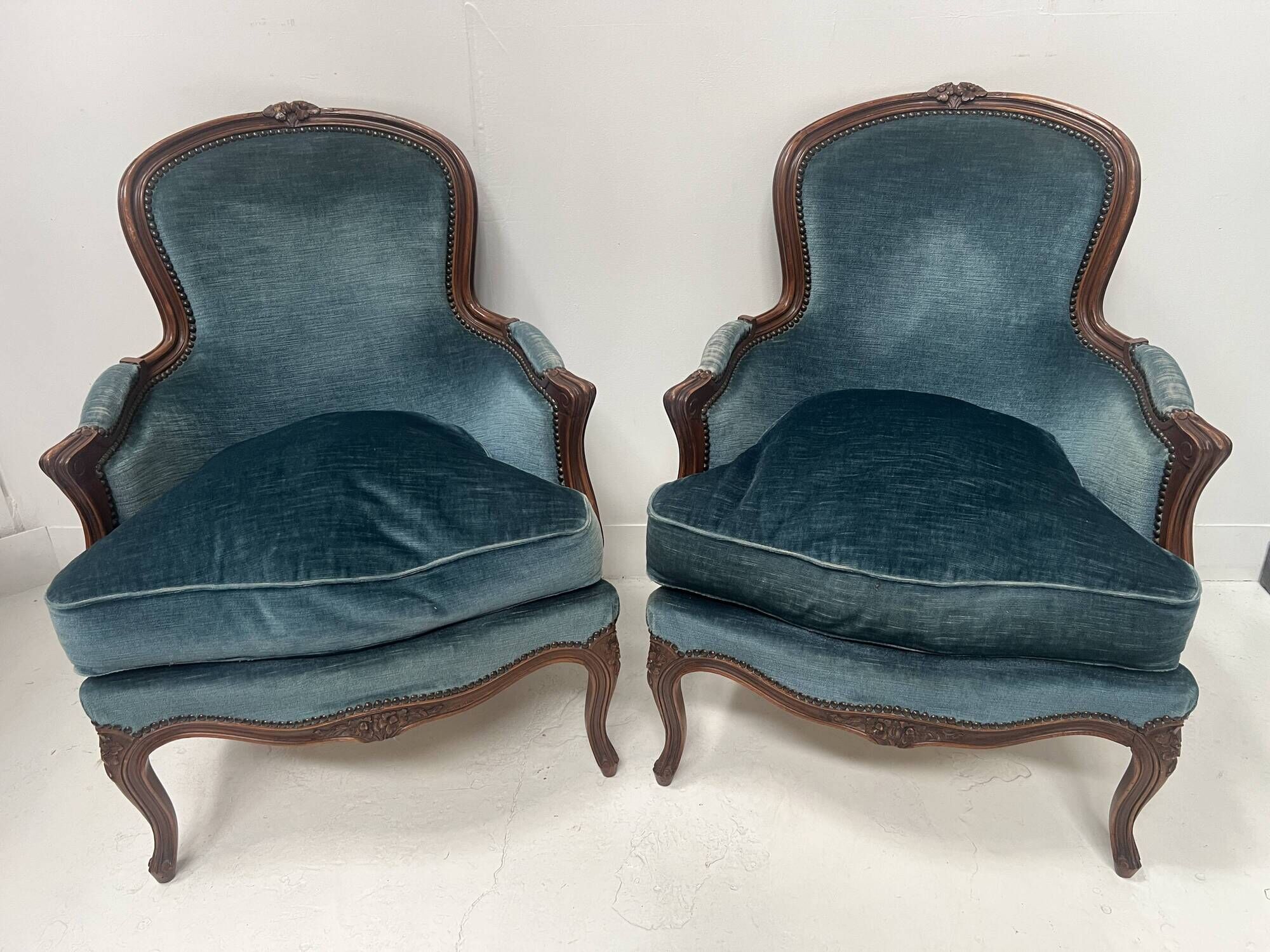 Pair of Louis XV style armchairs in natural wood, 20th century.