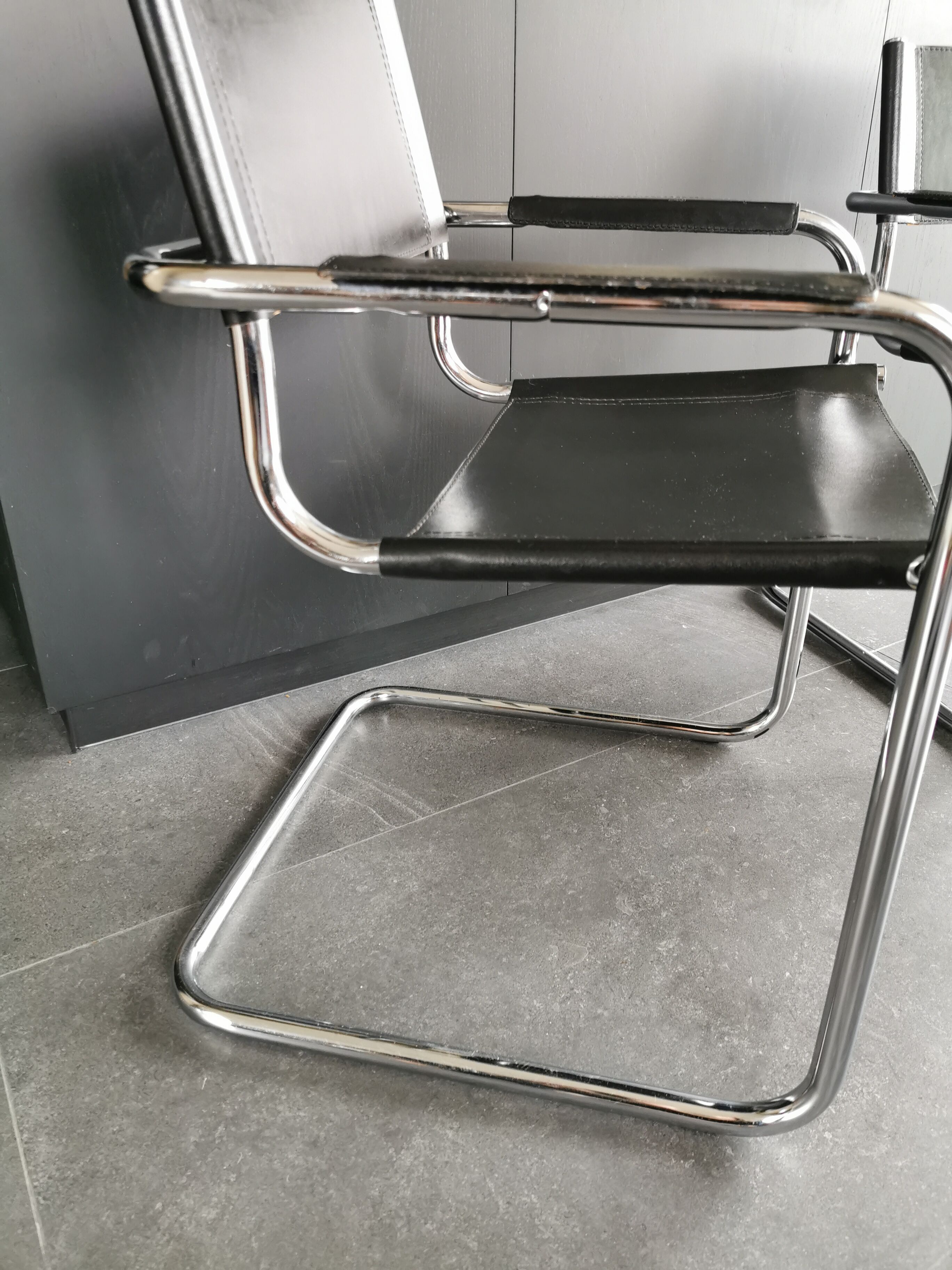 Metal and black leather design armchair pair