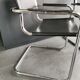 Metal and black leather design armchair pair