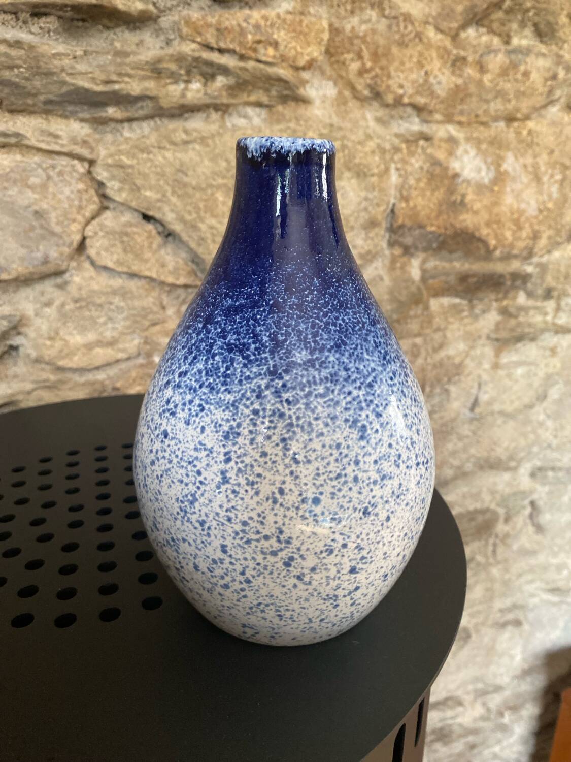 Blue and white speckled vase