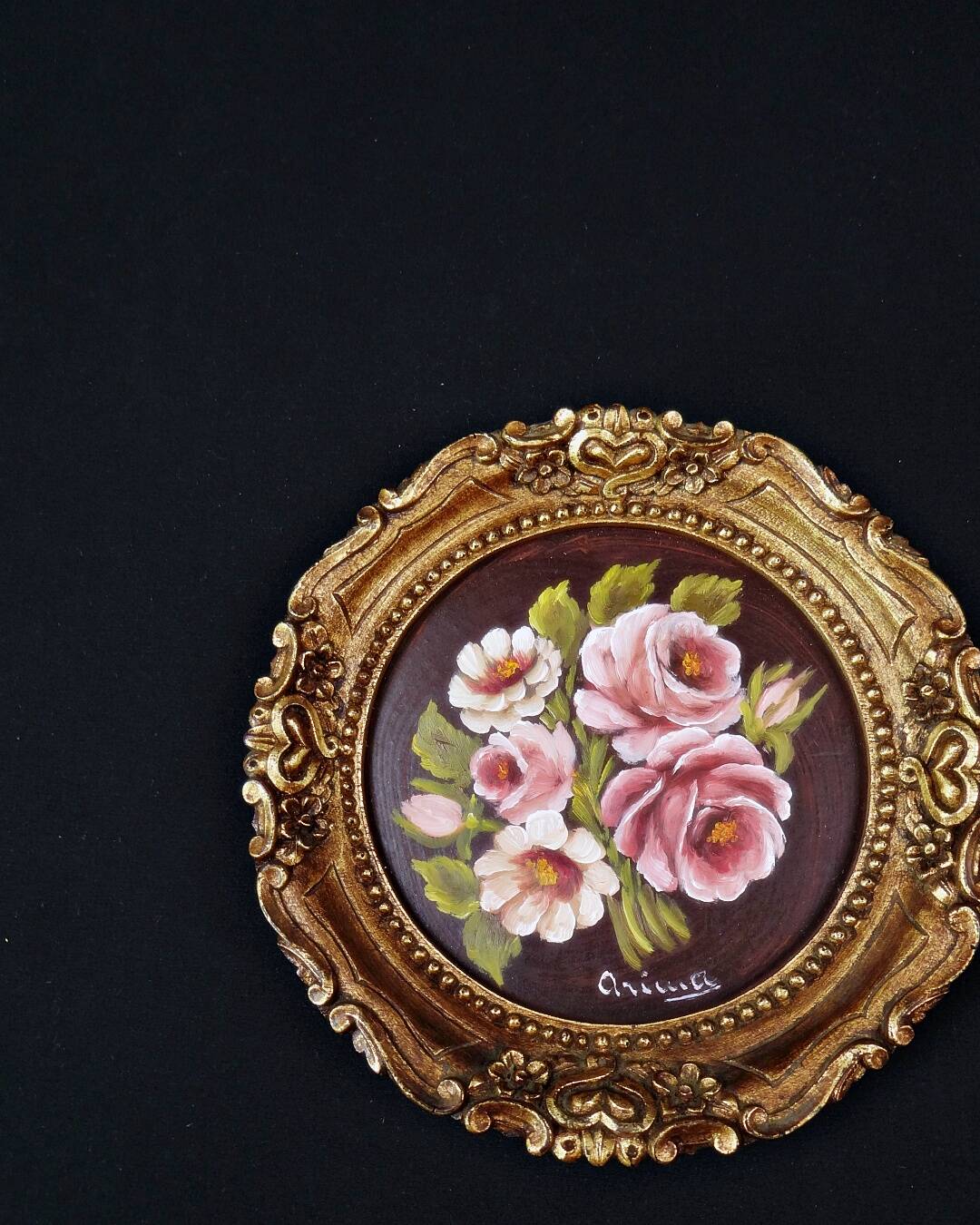 Still life in Tondo oil on panel of a bouquet of pink roses signed