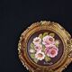 Still life in Tondo oil on panel of a bouquet of pink roses signed
